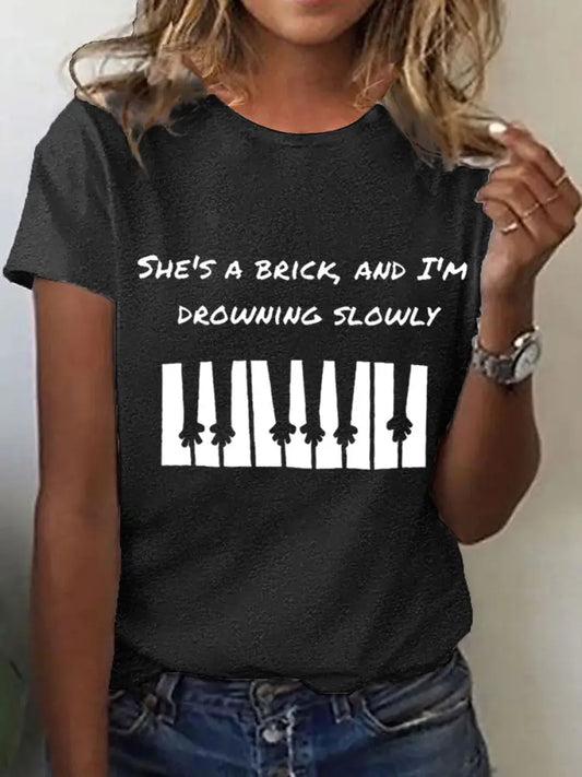 Women’s She’s a brick and I’m drowning slowly lyrics T-shirt Black / S